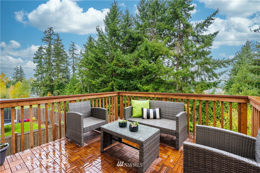 22708 41st Drive Southeast Bothell, WA 98021 - Photo 12 of 37 a balcony with wooden floor and outdoor seating