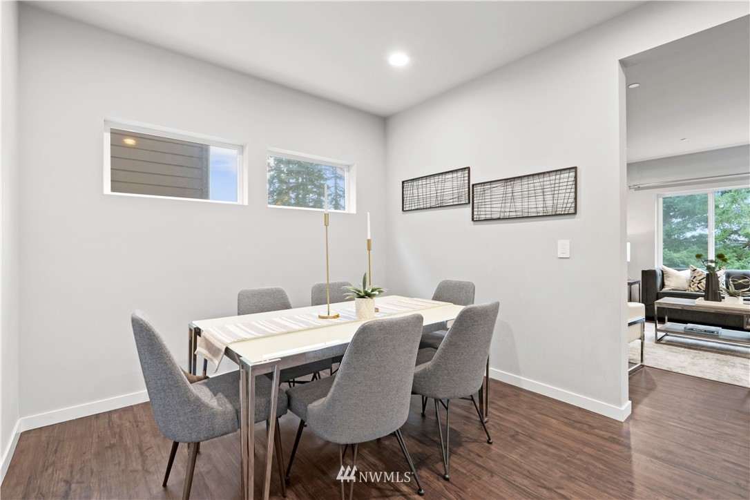 22708 41st Drive Southeast Bothell, WA 98021 - Photo 13 of 37 a view of a dining room with furniture wooden floor and chandelier