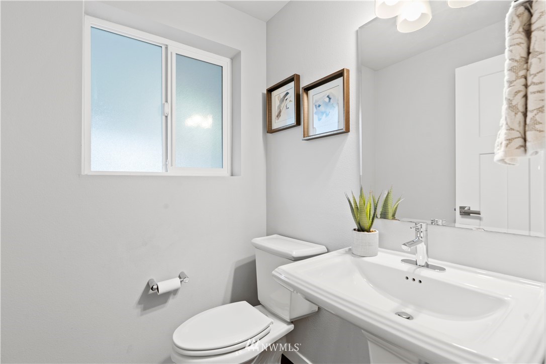 22708 41st Drive Southeast Bothell, WA 98021 - Photo 14 of 37 a bathroom with a sink a toilet and mirror