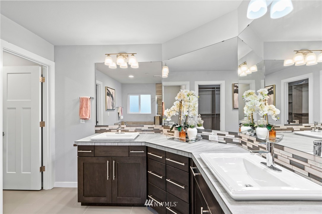 22708 41st Drive Southeast Bothell, WA 98021 - Photo 18 of 37 a bathroom with a sink vanity and mirror