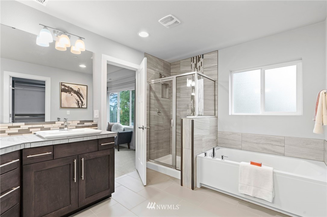 22708 41st Drive Southeast Bothell, WA 98021 - Photo 19 of 37 a bathroom with a tub sink shower and mirror
