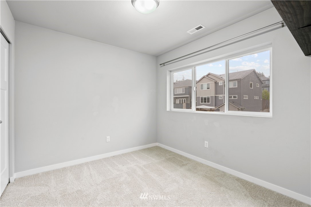 22708 41st Drive Southeast Bothell, WA 98021 - Photo 27 of 37 an empty room with windows