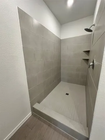 a view of hallway with wooden floor