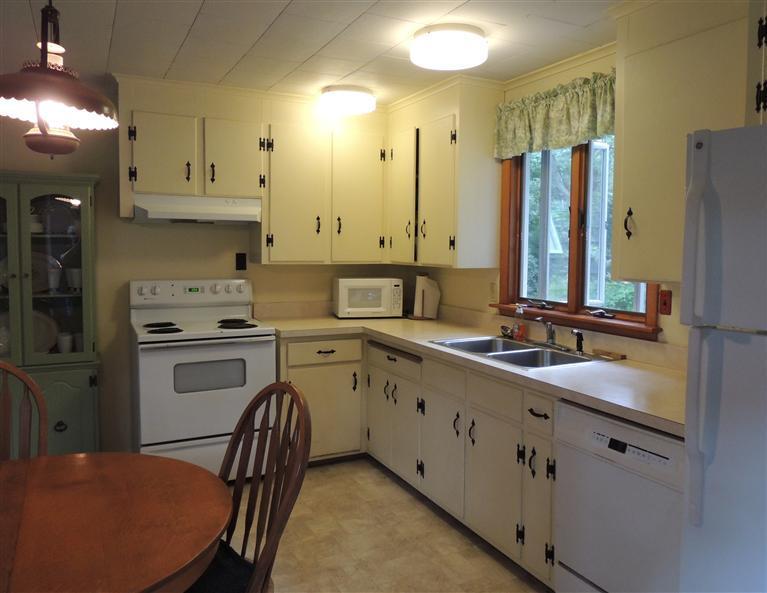 32 Frederick Road Falmouth, MA 02540 - Photo 5 of 20 a kitchen with stainless steel appliances a sink cabinets and wooden floor