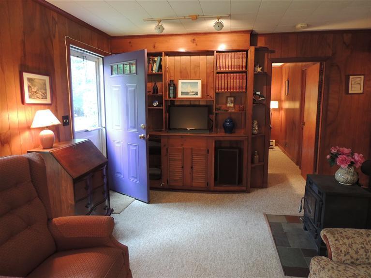 32 Frederick Road Falmouth, MA 02540 - Photo 7 of 20 a living room with furniture and a flat screen tv