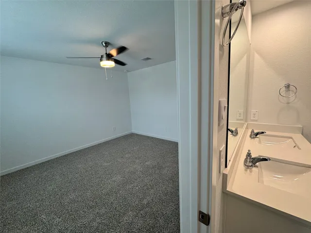 a bathroom with a sink a mirror and a shower