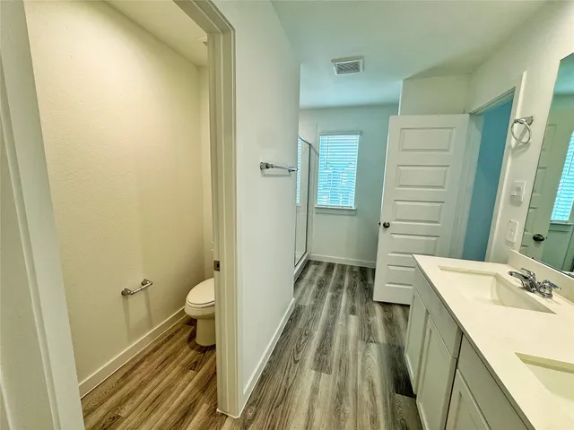 a bathroom with a sink a mirror and a shower