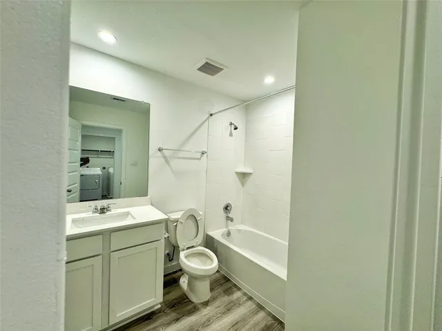 a view of a big house with a big yard and large trees