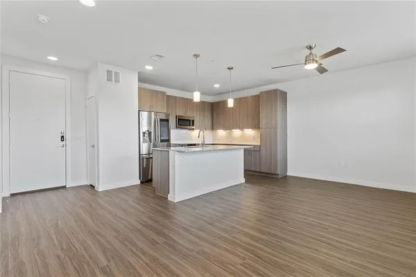 a view of kitchen with wooden floor