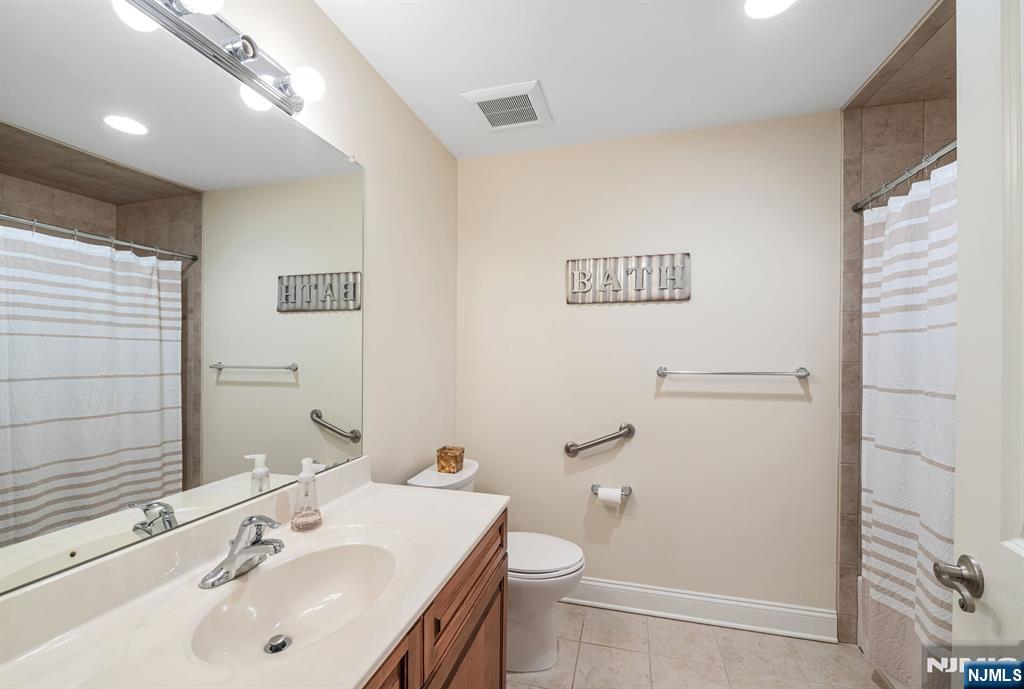 1508 Whitney Lane, Unit 1508 Allendale, NJ 07401 - Photo 15 of 24 a bathroom with a sink toilet and shower