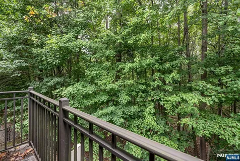 a view of a balcony with wooden floor