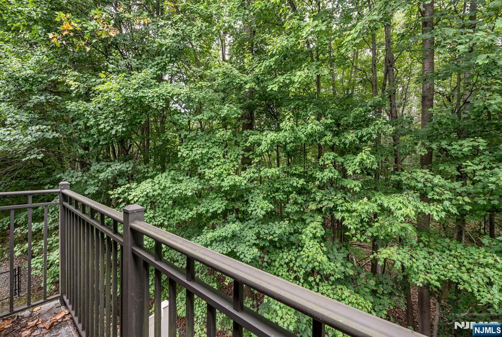 1508 Whitney Lane, Unit 1508 Allendale, NJ 07401 - Photo 16 of 24 a view of a balcony with wooden floor