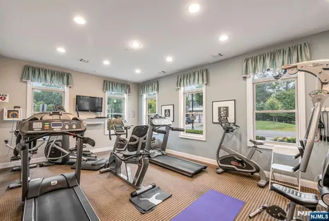 a view of a livingroom with furniture water view and a large window