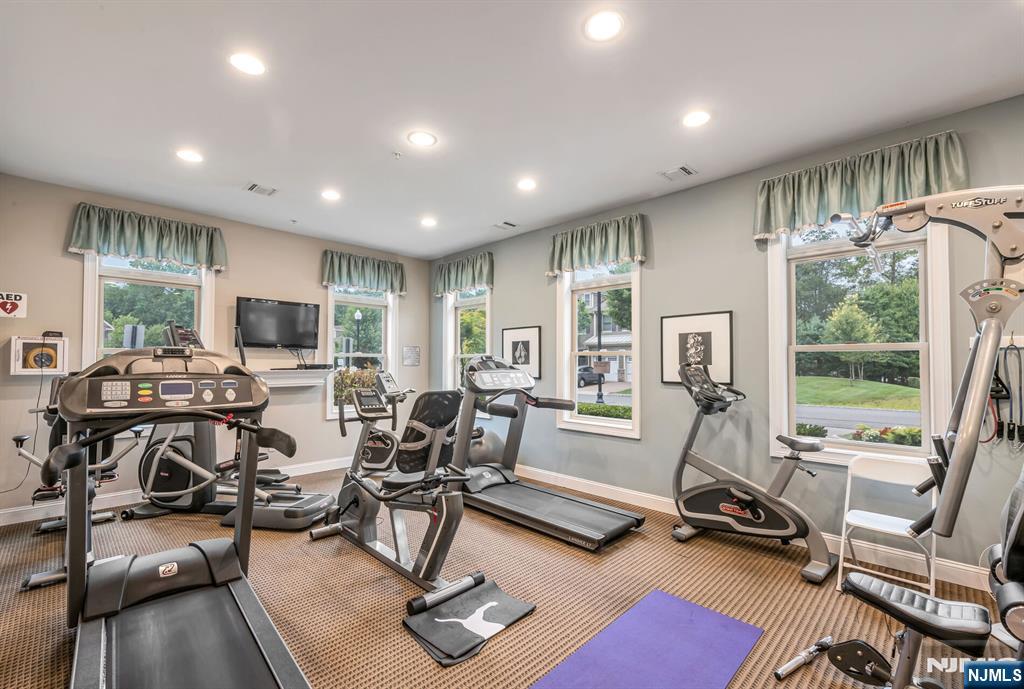 1508 Whitney Lane, Unit 1508 Allendale, NJ 07401 - Photo 20 of 24 a view of a livingroom with furniture water view and a large window