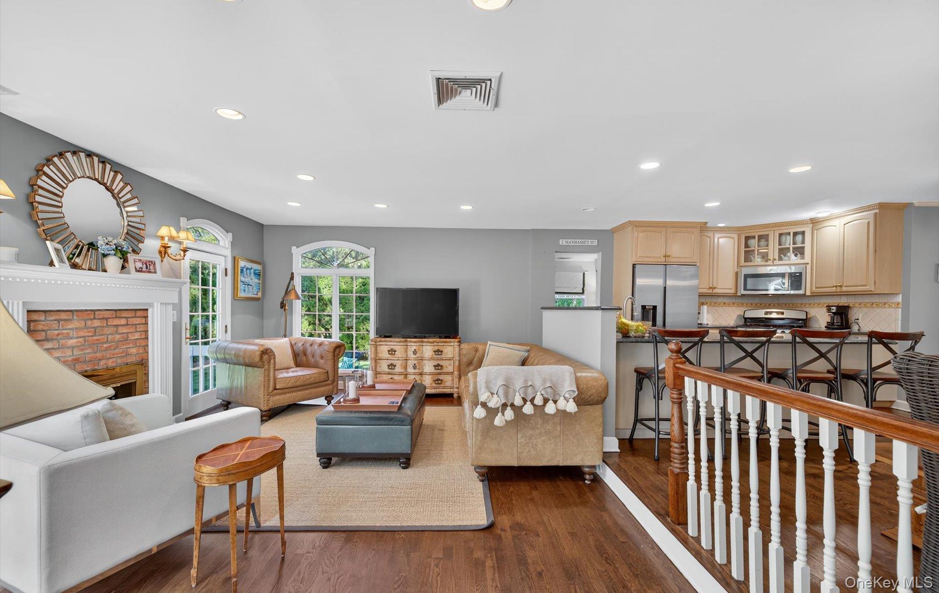 53 Eakins Road Manhasset, NY 11030 - Photo 13 of 34 a living room with furniture fireplace and a table