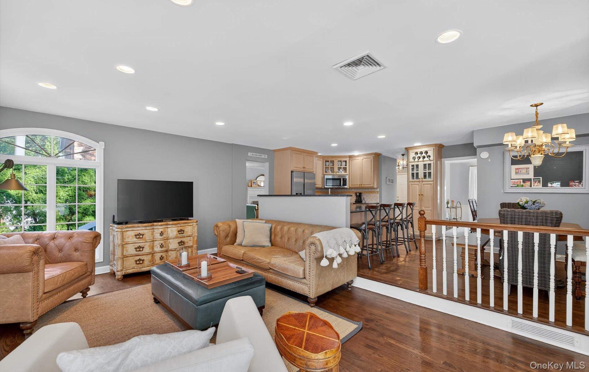 53 Eakins Road Manhasset, NY 11030 - Photo 14 of 34 a living room with furniture and a flat screen tv