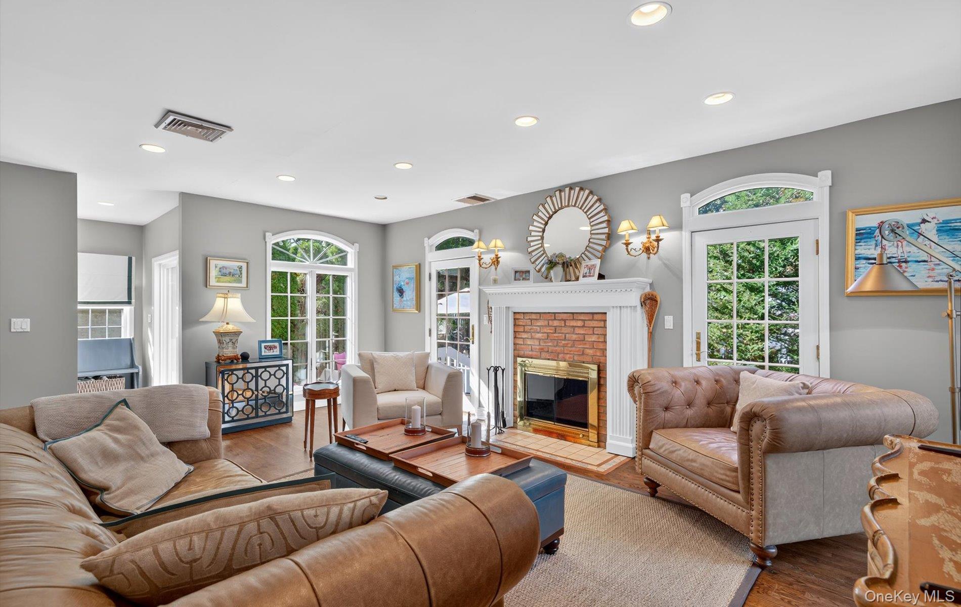 53 Eakins Road Manhasset, NY 11030 - Photo 15 of 34 a living room with furniture and a fireplace