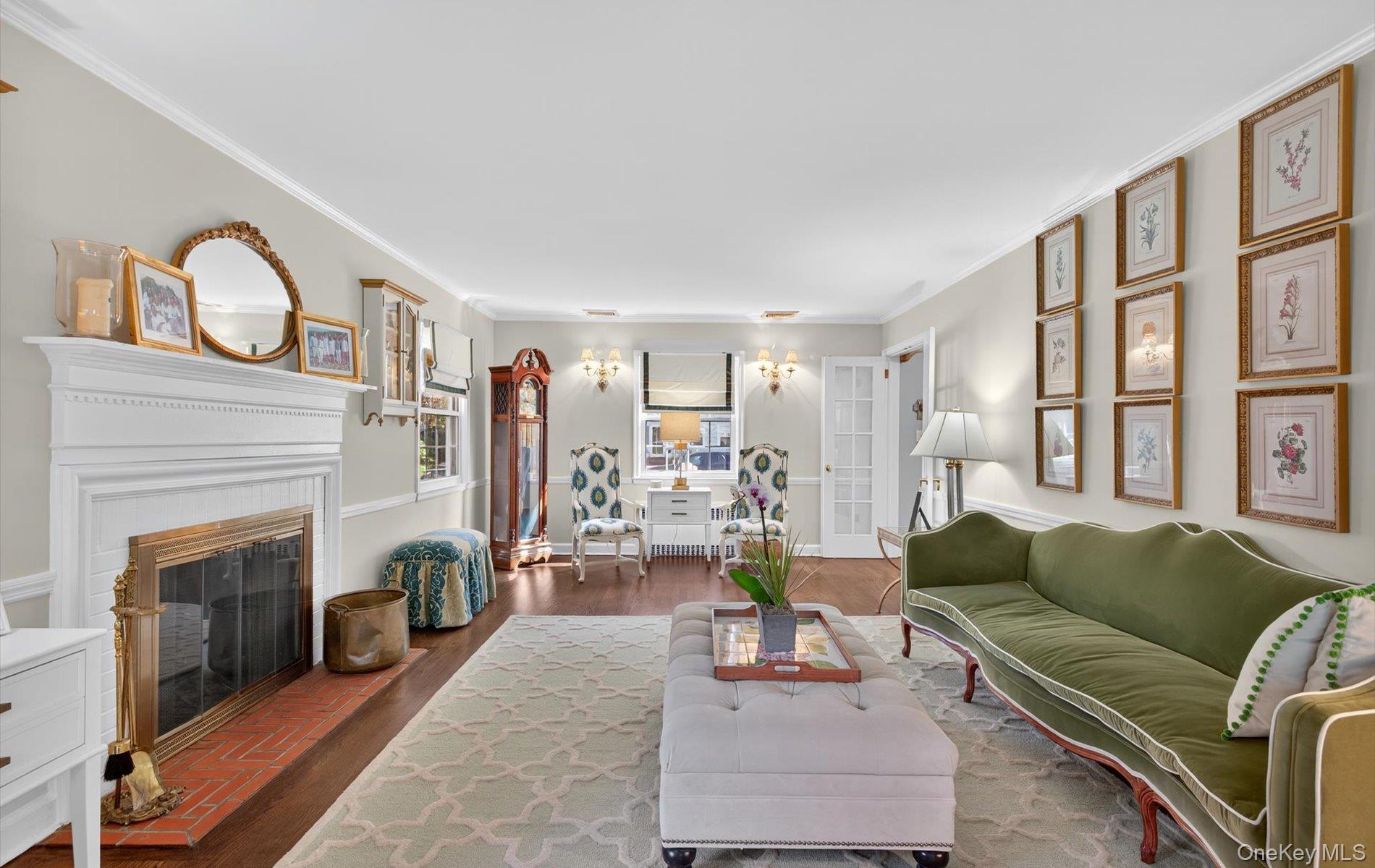 53 Eakins Road Manhasset, NY 11030 - Photo 17 of 34 a living room with furniture and a fireplace