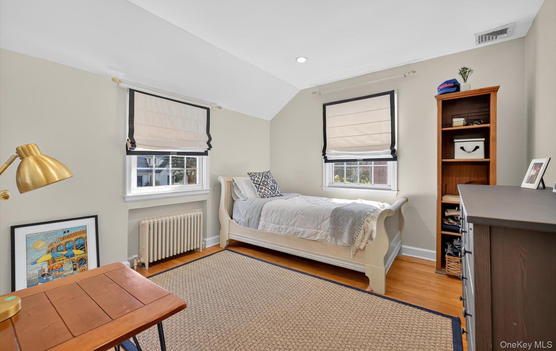 53 Eakins Road Manhasset, NY 11030 - Photo 27 of 34 a bedroom with a bed furniture and a window