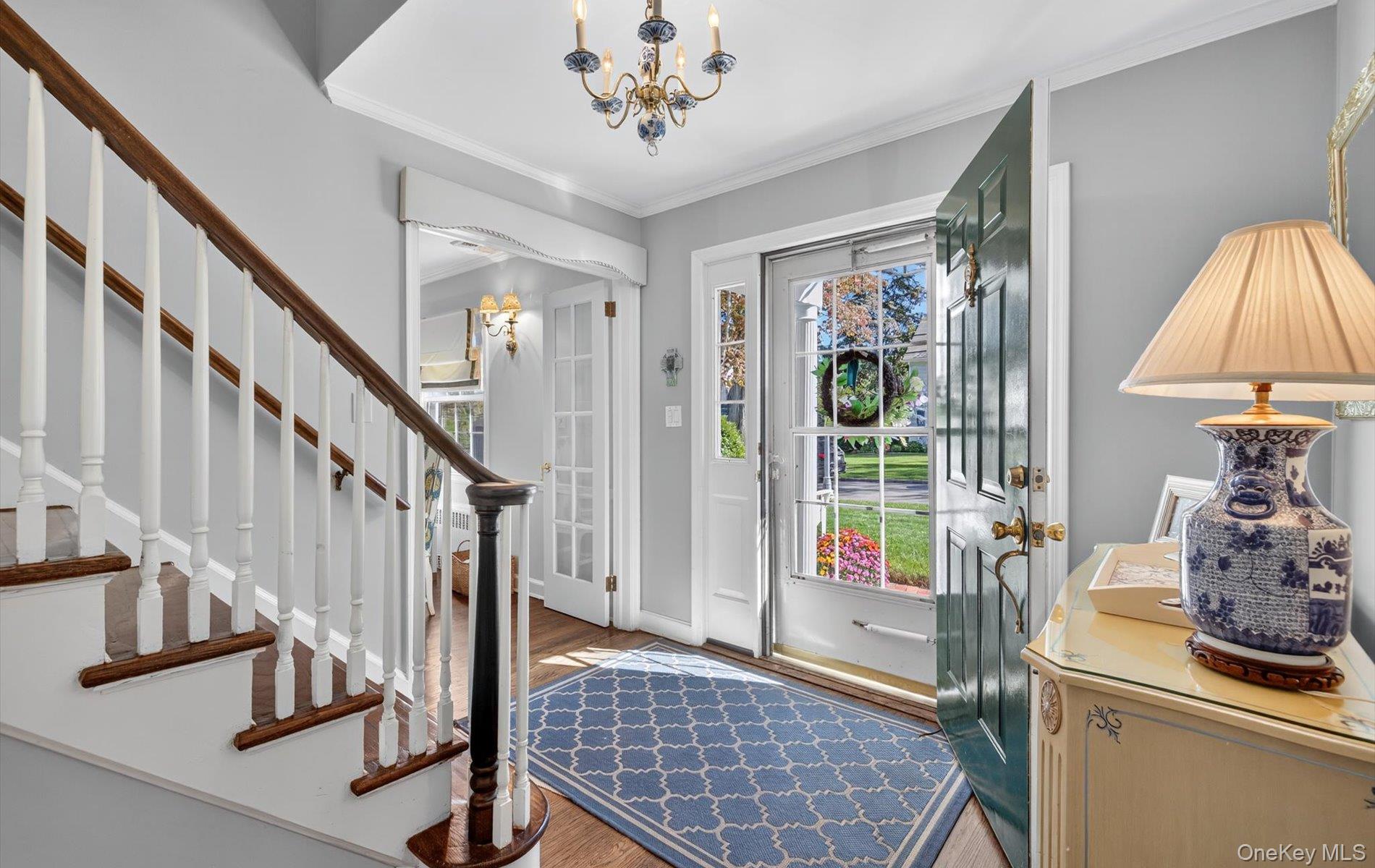 53 Eakins Road Manhasset, NY 11030 - Photo 5 of 34 a view of an entryway with wooden floor and door