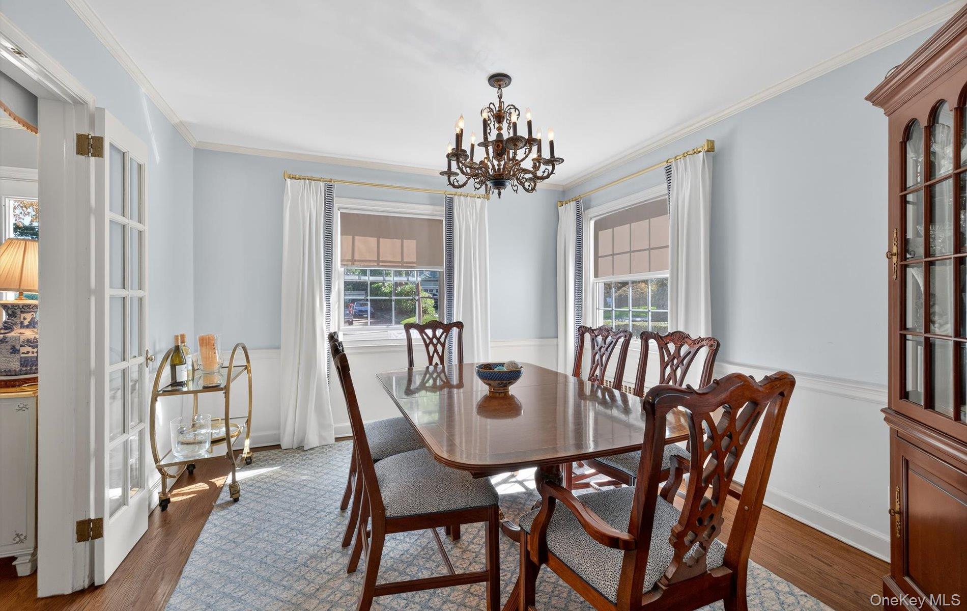 53 Eakins Road Manhasset, NY 11030 - Photo 7 of 34 a view of a dining room with furniture window and wooden floor
