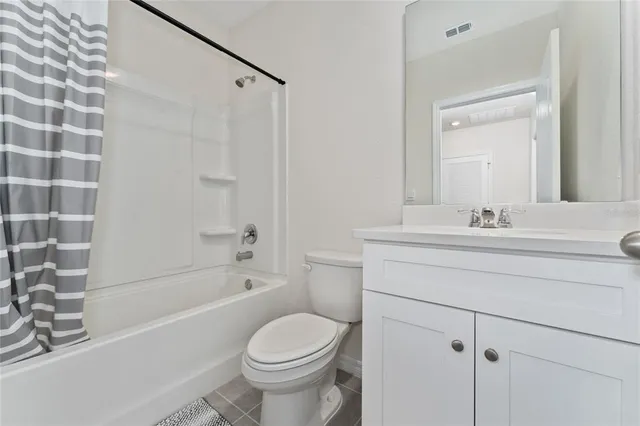 a bathroom with a sink a toilet and a bathtub