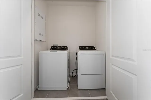 a utility room with dryer and washer