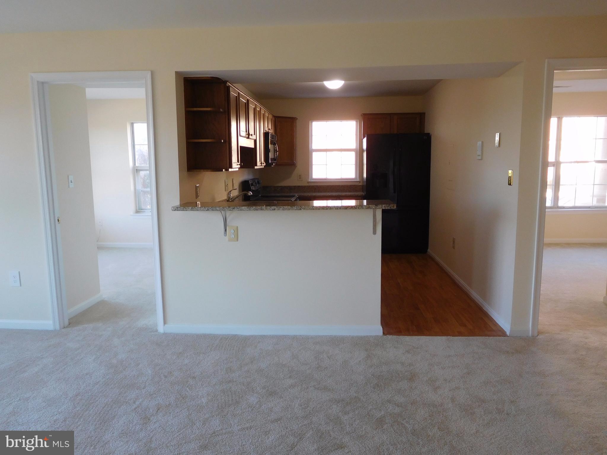 304 Ridgepoint Place, Unit 14 Gaithersburg, MD 20878 - Photo 5 of 25 Dining Room and Kitchen Entrance