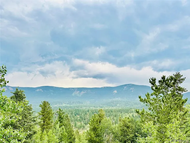 a dining hall with a dining table and chairs with wooden floor