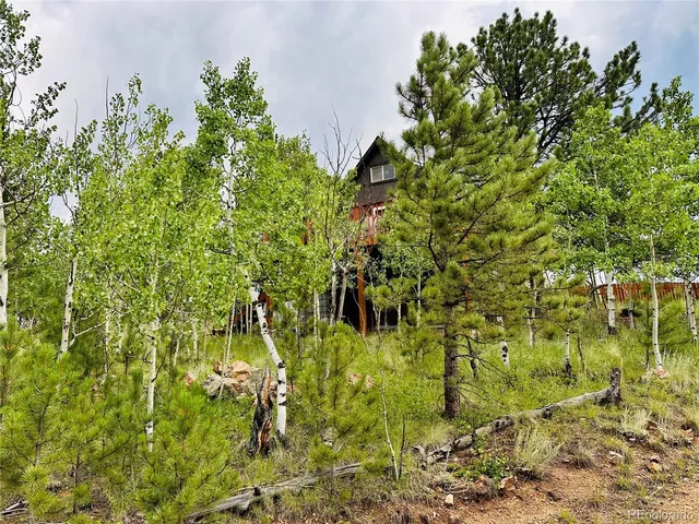 a living room with kitchen furniture and a table