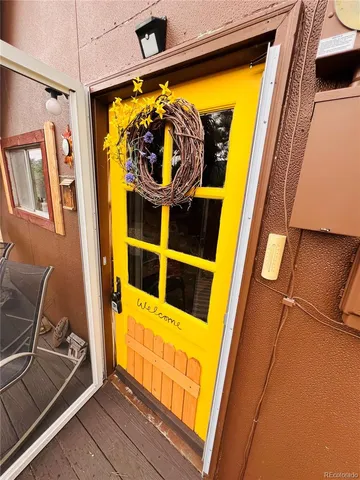 a bedroom with furniture and a flat screen tv