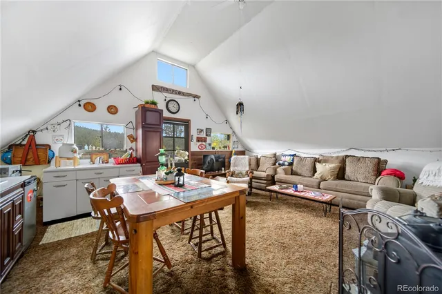 a view of balcony with wooden floor and outdoor seating