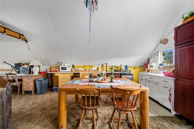 a view of a balcony with chairs