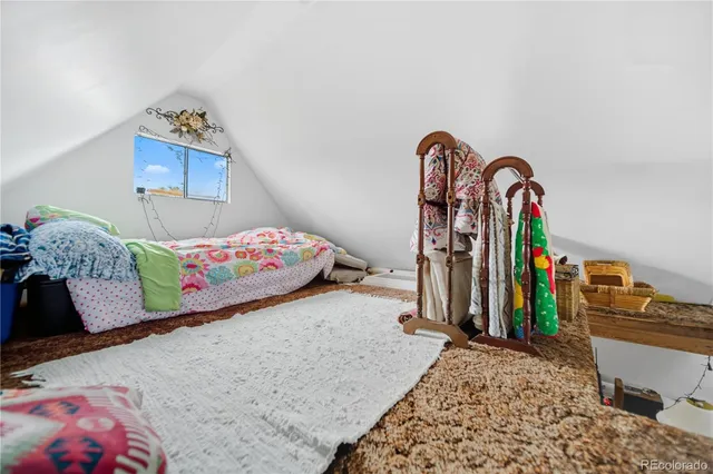 a view of a lake with houses in the back