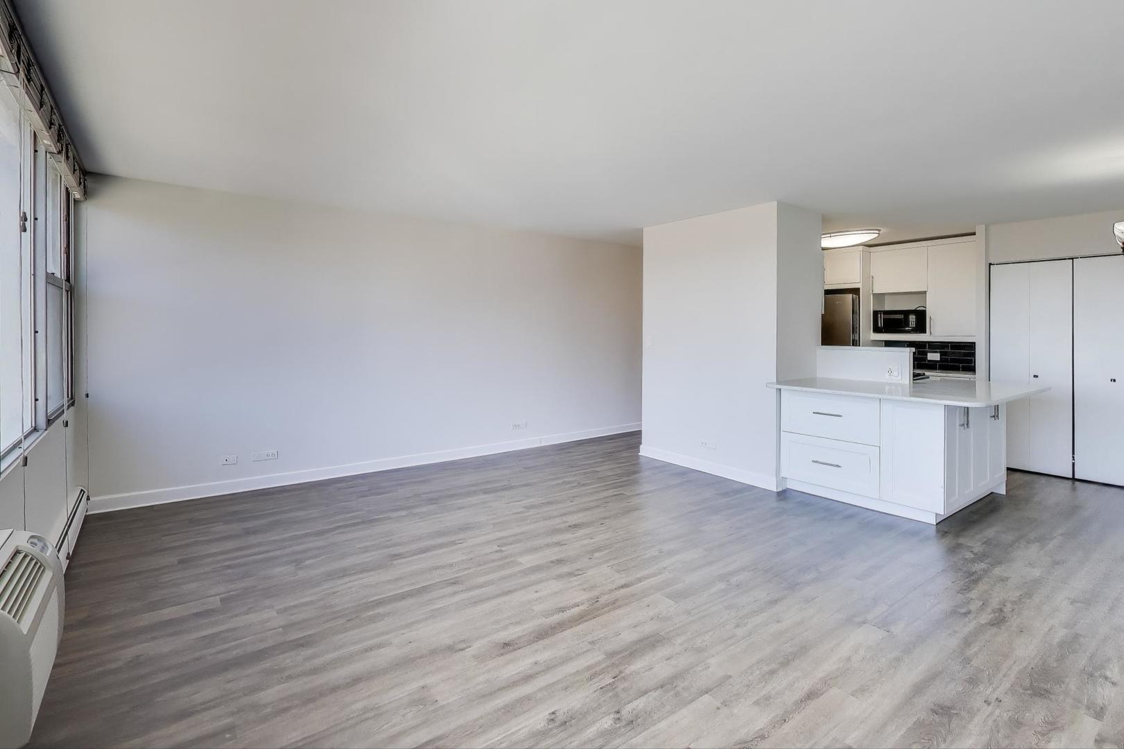 Undisclosed Address Lombard, IL 60148 - Photo 13 of 37 a view of a kitchen with wooden floor and electronic appliances