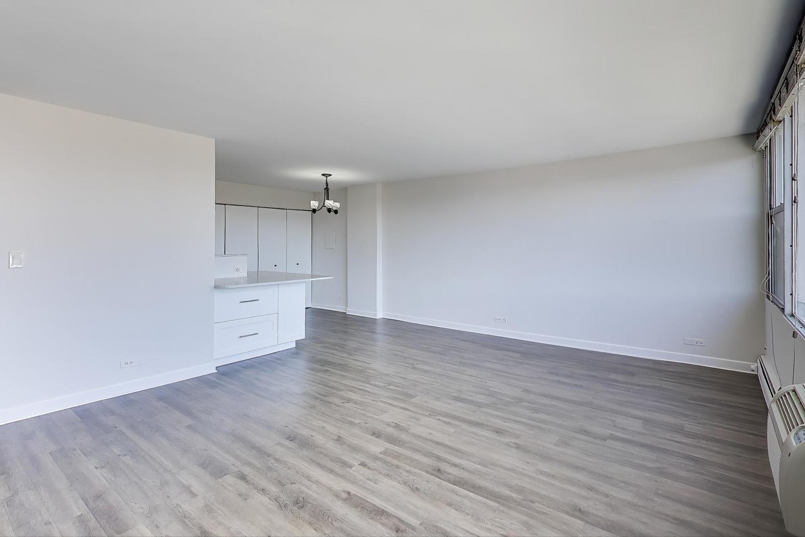 Undisclosed Address Lombard, IL 60148 - Photo 15 of 37 a view of an empty room with wooden floor and a window