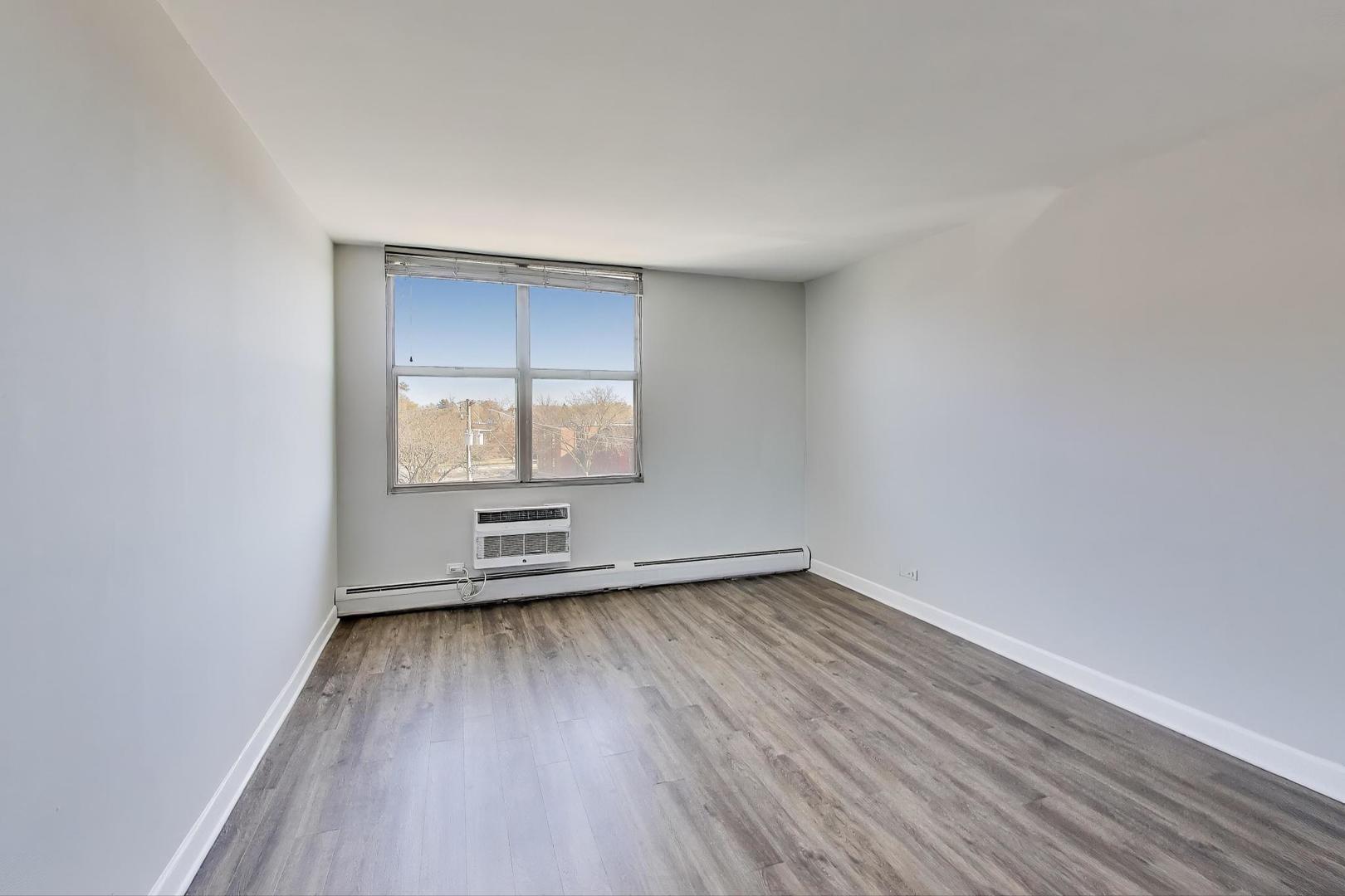 Undisclosed Address Lombard, IL 60148 - Photo 20 of 37 an empty room with wooden floor and windows