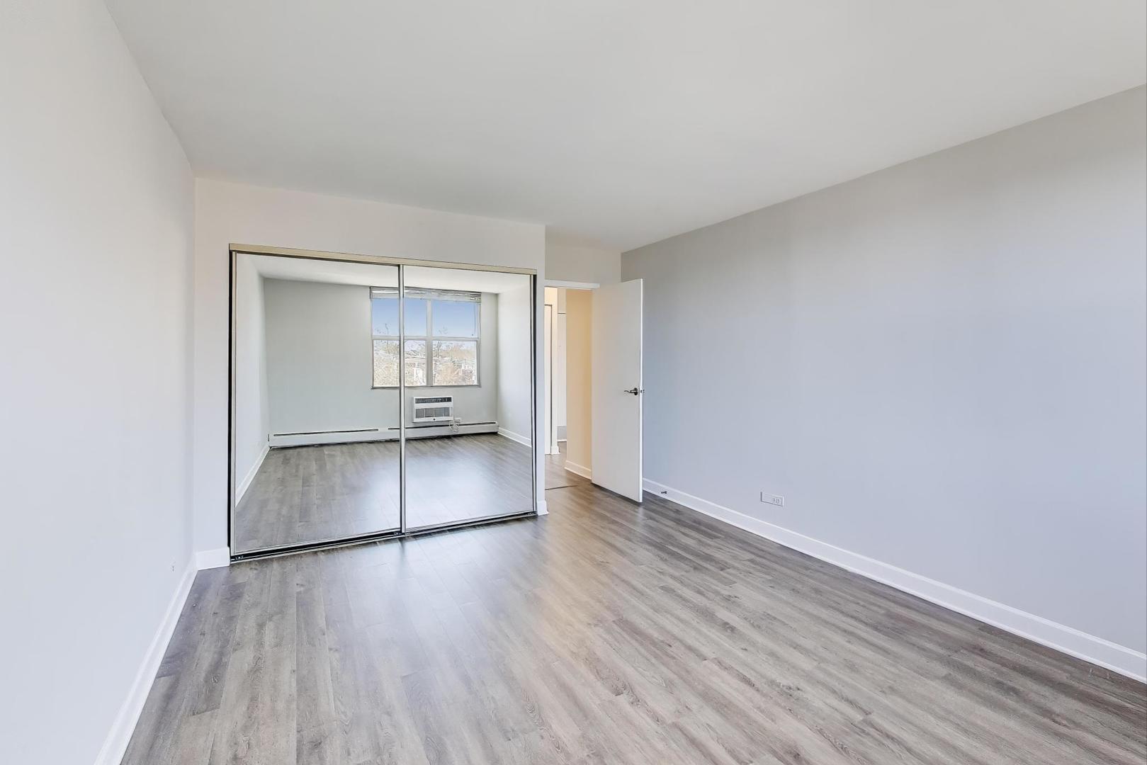 Undisclosed Address Lombard, IL 60148 - Photo 23 of 37 wooden floor in an empty room with a window