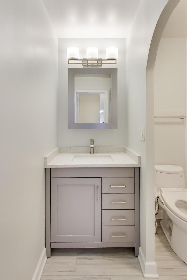 Undisclosed Address Lombard, IL 60148 - Photo 25 of 37 a bathroom with a sink vanity and mirror