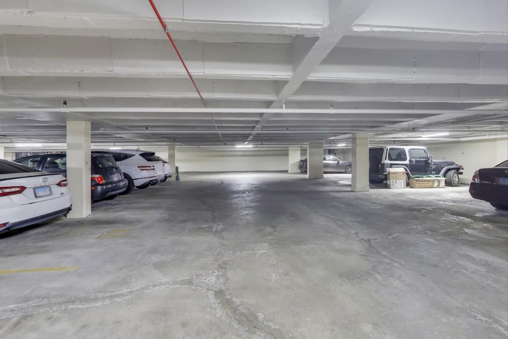 Undisclosed Address Lombard, IL 60148 - Photo 31 of 37 a view of parking garage with cars