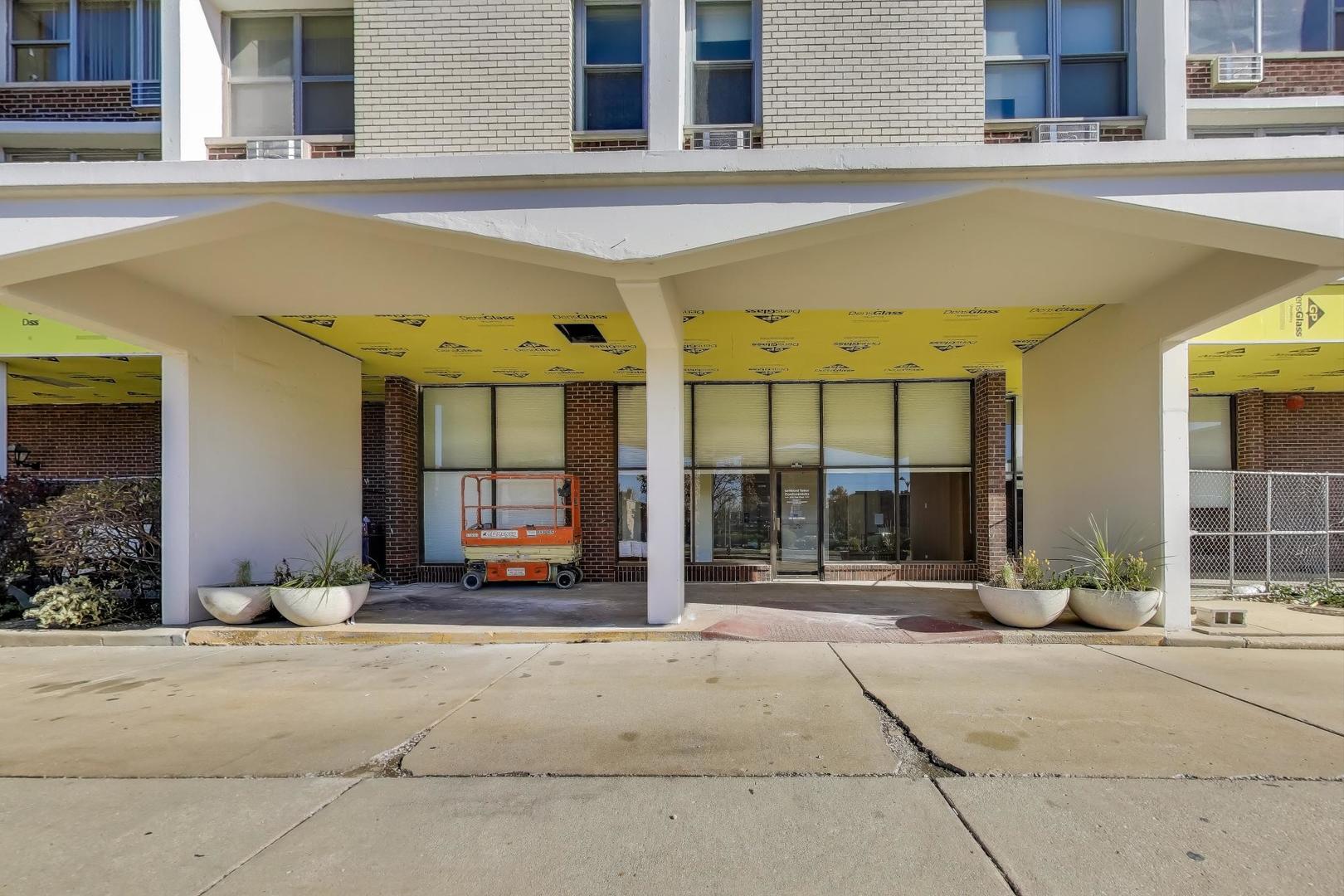 Undisclosed Address Lombard, IL 60148 - Photo 4 of 37 a front view of a building with retail shop