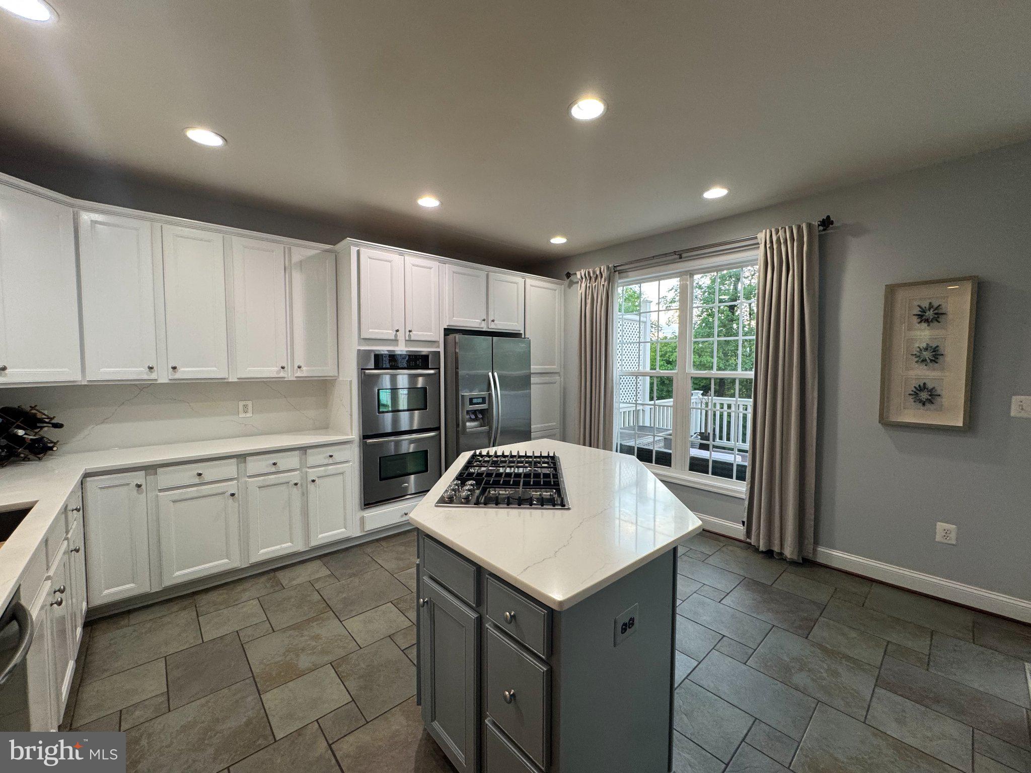 25577 Soft Mist Terrace Aldie, VA 20105 - Photo 13 of 30 Bright and airy modern kitchen space.