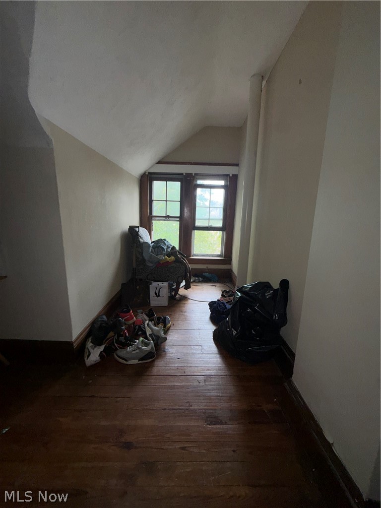 3217 Sycamore Road Cleveland Heights, OH 44118 - Photo 8 of 18 Hardwood flooring, painted walls, two windows with dark trim, sloped ceiling