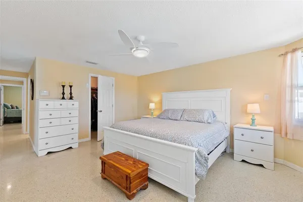 a bedroom with a bed and dresser