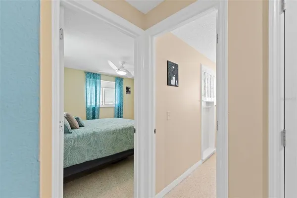 a living room with furniture and a walk in closet