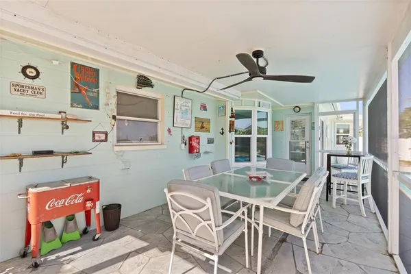 a dining room with furniture and window