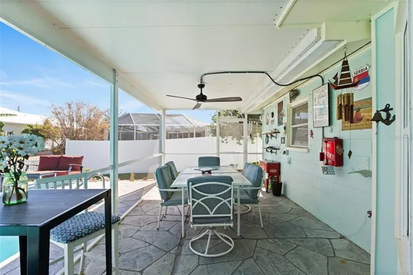 a work room with furniture and a floor to ceiling window