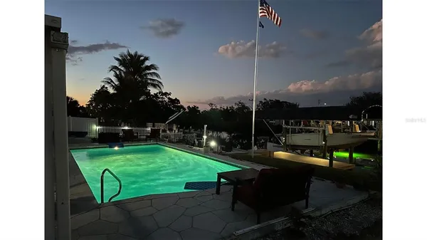 a view of a backyard with sitting area