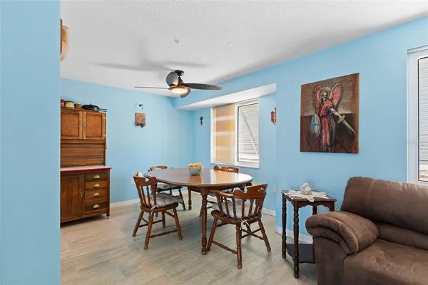 a dining room with furniture and window