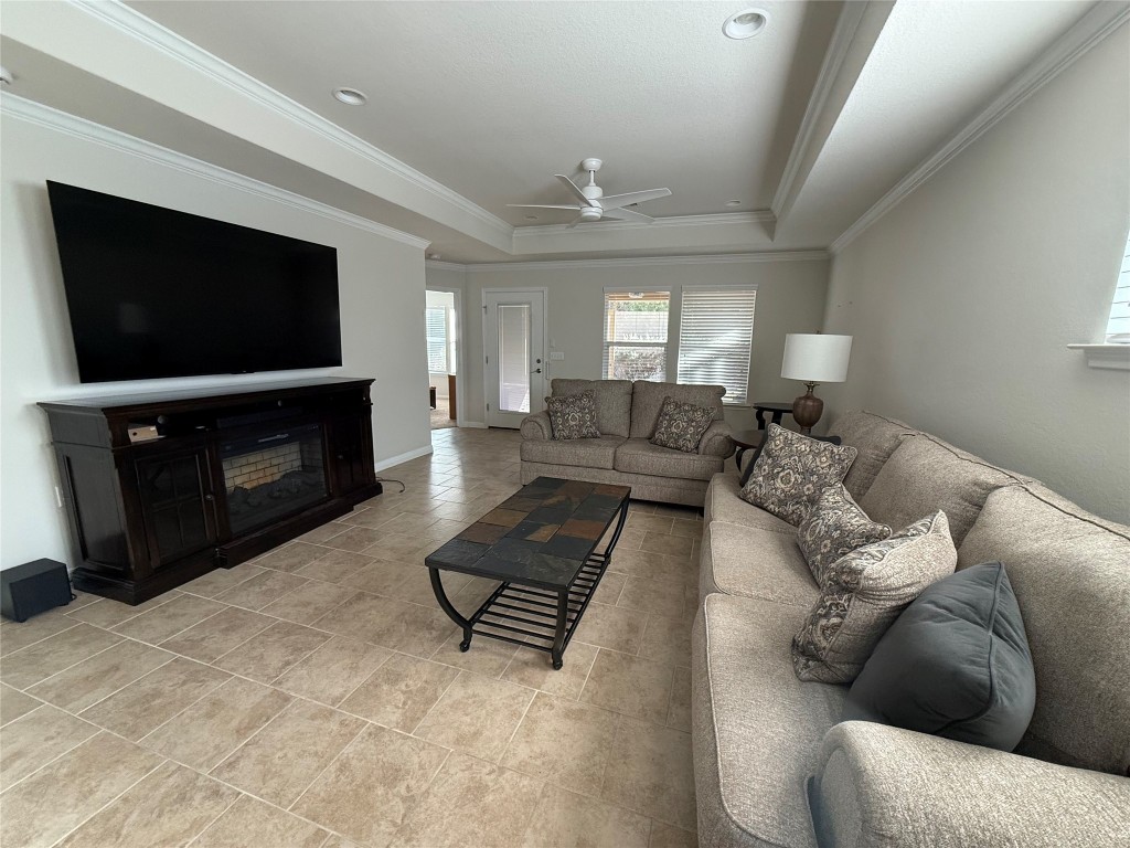 233 Hobby Street Georgetown, TX 78633 - Photo 3 of 13 a living room with furniture and a flat screen tv